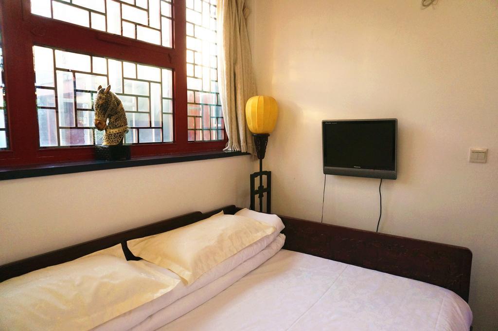 Templeside Deluxe Hutong Hotel Pekín Habitación foto