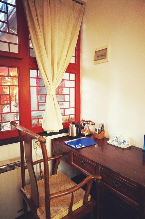 Templeside Deluxe Hutong Hotel Pekín Habitación foto